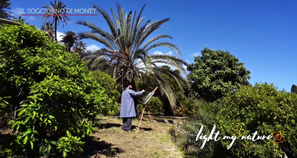 Fotogramma di un video in cui Monet dipinge in mezzo al verde a Bordighera