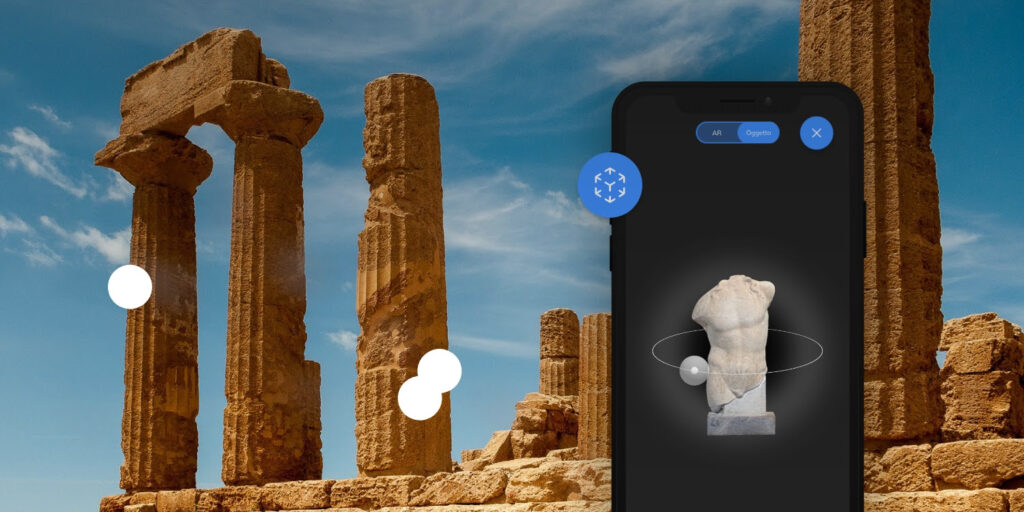 mockup applicazione del mondo ett, immagine della parte di AR in cui si vede un busto di una statua grega su sfondo nero nel cellulare, come sfondo le rovine delle colonne di un templio greco